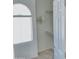 Walk-in closet with built-in shelving and rods, complemented by natural light from a window at 7925 S 52Nd Dr, Laveen, AZ 85339