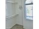 Walk-in closet offering shelving and a window with natural light at 7925 S 52Nd Dr, Laveen, AZ 85339