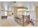 Spacious loft featuring seating, a built-in bar, and views of the living room and dining area at 795 W Verbena Ln, Litchfield Park, AZ 85340