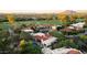 Stunning aerial image of a golf community featuring luxury homes, manicured lawns, and a sparkling swimming pool at 8255 E Vista De Valle --, Scottsdale, AZ 85255