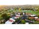 Scenic aerial view of a golf course community showcasing lush landscaping and beautiful homes with red tile roofs at 8255 E Vista De Valle --, Scottsdale, AZ 85255