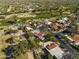 Aerial view of houses nestled next to a golf course, showcasing neighborhood and course layout at 8255 E Vista De Valle --, Scottsdale, AZ 85255
