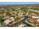 An aerial view of the community, with houses next to a golf course and mountain views in the distance at 8255 E Vista De Valle --, Scottsdale, AZ 85255