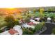 Expansive estate with a red-tile roof, lush landscaping, pool, and views of the golf course at 8255 E Vista De Valle --, Scottsdale, AZ 85255