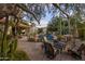 Expansive backyard with a pool, lounge area, and lush desert landscaping, perfect for relaxing and entertaining at 8255 E Vista De Valle --, Scottsdale, AZ 85255