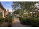 Picturesque backyard with a pool, desert landscaping, and multiple seating areas, ideal for outdoor living at 8255 E Vista De Valle --, Scottsdale, AZ 85255