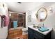 Well-lit bathroom features shower-tub combo, large mirror, and vanity sink at 8255 E Vista De Valle --, Scottsdale, AZ 85255