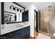 Luxurious bathroom features custom vanity with marble countertop and a walk-in shower at 8255 E Vista De Valle --, Scottsdale, AZ 85255