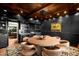 Elegant dining room with dark walls, a wood-paneled ceiling, and a round table with seating for eight at 8255 E Vista De Valle --, Scottsdale, AZ 85255