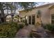 Desert home featuring a peaceful backyard retreat with a patio and landscaped garden at 8255 E Vista De Valle --, Scottsdale, AZ 85255