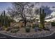 Charming desert home featuring well-manicured landscaping and traditional architecture, creating curb appeal at 8255 E Vista De Valle --, Scottsdale, AZ 85255