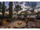 Inviting outdoor firepit area with comfortable seating, perfect for enjoying evenings with sunset views at 8255 E Vista De Valle --, Scottsdale, AZ 85255