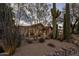 Charming single-story home featuring desert landscaping, a red tile roof, and a welcoming entrance at 8255 E Vista De Valle --, Scottsdale, AZ 85255