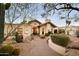 Charming front exterior featuring desert landscaping with various cacti, shrubs, and natural rock features at 8255 E Vista De Valle --, Scottsdale, AZ 85255