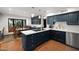 Charming kitchen features custom blue cabinets, white countertops, stainless appliances, and eat-in breakfast nook at 8255 E Vista De Valle --, Scottsdale, AZ 85255