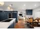Gourmet kitchen with custom blue cabinetry, white counters, stainless appliances, and views to the Gathering room at 8255 E Vista De Valle --, Scottsdale, AZ 85255