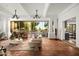 Bright living room with terracotta floors, a modern fireplace, and sliding doors leading to the patio at 8255 E Vista De Valle --, Scottsdale, AZ 85255