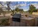 Outdoor kitchen with grill and sink, perfect for entertaining and enjoying the beautiful desert scenery at 8255 E Vista De Valle --, Scottsdale, AZ 85255