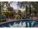 Inviting pool with lounge chairs for relaxation, surrounded by lush desert vegetation for privacy at 8255 E Vista De Valle --, Scottsdale, AZ 85255