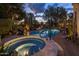 Backyard with tiled spa and pool with professional landscaping, creating a luxurious retreat at 8255 E Vista De Valle --, Scottsdale, AZ 85255