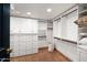Spacious walk-in closet featuring custom shelving, drawers, and ample storage space at 8255 E Vista De Valle --, Scottsdale, AZ 85255