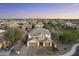 Beautiful aerial view of a well-maintained property in a residential neighborhood at twilight at 831 E Tonto Pl, Chandler, AZ 85249