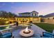 Beautiful backyard featuring a pool, patio with outdoor furniture, fire pit, and manicured landscaping at 831 E Tonto Pl, Chandler, AZ 85249