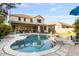 Lush backyard featuring a sparkling pool, outdoor seating area, and mature landscaping at 831 E Tonto Pl, Chandler, AZ 85249