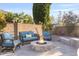 Backyard seating area with a fire pit, comfortable seating, and a privacy wall at 831 E Tonto Pl, Chandler, AZ 85249