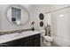 Bathroom features a modern vanity, decorative mirror, and a shower-tub combination at 831 E Tonto Pl, Chandler, AZ 85249