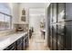 Kitchen with dark cabinets, granite countertops, modern backsplash, and eat-in dining room at 831 E Tonto Pl, Chandler, AZ 85249