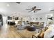 Open-concept living room connected to kitchen, offering ample space and a ceiling fan at 831 E Tonto Pl, Chandler, AZ 85249