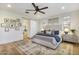 Spacious main bedroom with large bed, ceiling fan, and natural light at 831 E Tonto Pl, Chandler, AZ 85249