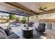 Inviting outdoor patio with a cozy seating area, built-in grill, and a sparkling pool at 831 E Tonto Pl, Chandler, AZ 85249