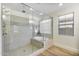 Modern shower with glass door and separate soaking tub at 831 E Tonto Pl, Chandler, AZ 85249