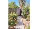 Backyard path with flowers leading to gate at 8419 E Stella Ln, Scottsdale, AZ 85250