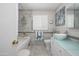 Nicely updated bathroom featuring double vessel sinks, stylish decor, and a shower/tub combo at 8419 E Stella Ln, Scottsdale, AZ 85250