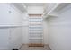 Walk-in closet with built-in shelving and ample storage space at 8419 E Stella Ln, Scottsdale, AZ 85250