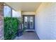 Welcoming front entrance featuring double doors and a covered porch at 8419 E Stella Ln, Scottsdale, AZ 85250