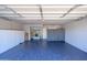 Spacious garage with storage cabinets and painted floor at 8419 E Stella Ln, Scottsdale, AZ 85250