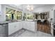 Bright kitchen featuring white cabinets, granite countertops, stainless steel appliances, and breakfast nook at 8419 E Stella Ln, Scottsdale, AZ 85250