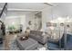 Bright living room featuring vaulted ceilings, exposed beams, modern furnishings and hardwood floors at 8419 E Stella Ln, Scottsdale, AZ 85250