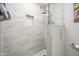 Shower featuring designer tile and rain shower head at 8419 E Stella Ln, Scottsdale, AZ 85250