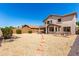 Home's backyard featuring a rock garden and outdoor seating areas at 8755 E Portobello Ave, Mesa, AZ 85212
