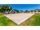 Enjoy outdoor activities at the community's well-maintained basketball court, with covered picnic area and lush green surroundings at 8755 E Portobello Ave, Mesa, AZ 85212