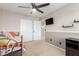 Comfortable bedroom features neutral color walls, a ceiling fan, and closet at 8755 E Portobello Ave, Mesa, AZ 85212