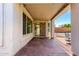 Covered patio with string lights and outdoor seating area at 8755 E Portobello Ave, Mesa, AZ 85212