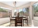 Bright dining area surrounded by large windows at 8755 E Portobello Ave, Mesa, AZ 85212