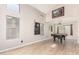 Spacious game room showcasing a pool table, high ceilings, neutral walls and ample natural light at 8755 E Portobello Ave, Mesa, AZ 85212
