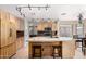 Beautiful kitchen featuring an island, modern lighting, and stainless steel appliances at 8755 E Portobello Ave, Mesa, AZ 85212